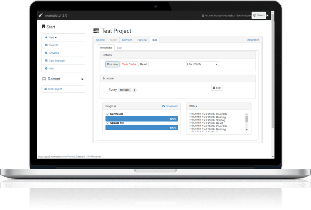 A laptop with a Normalator dashboard on screen, titled Test Project